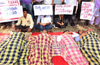 DYFI  protests in a unique style against  District Health Officials in Mangaluru